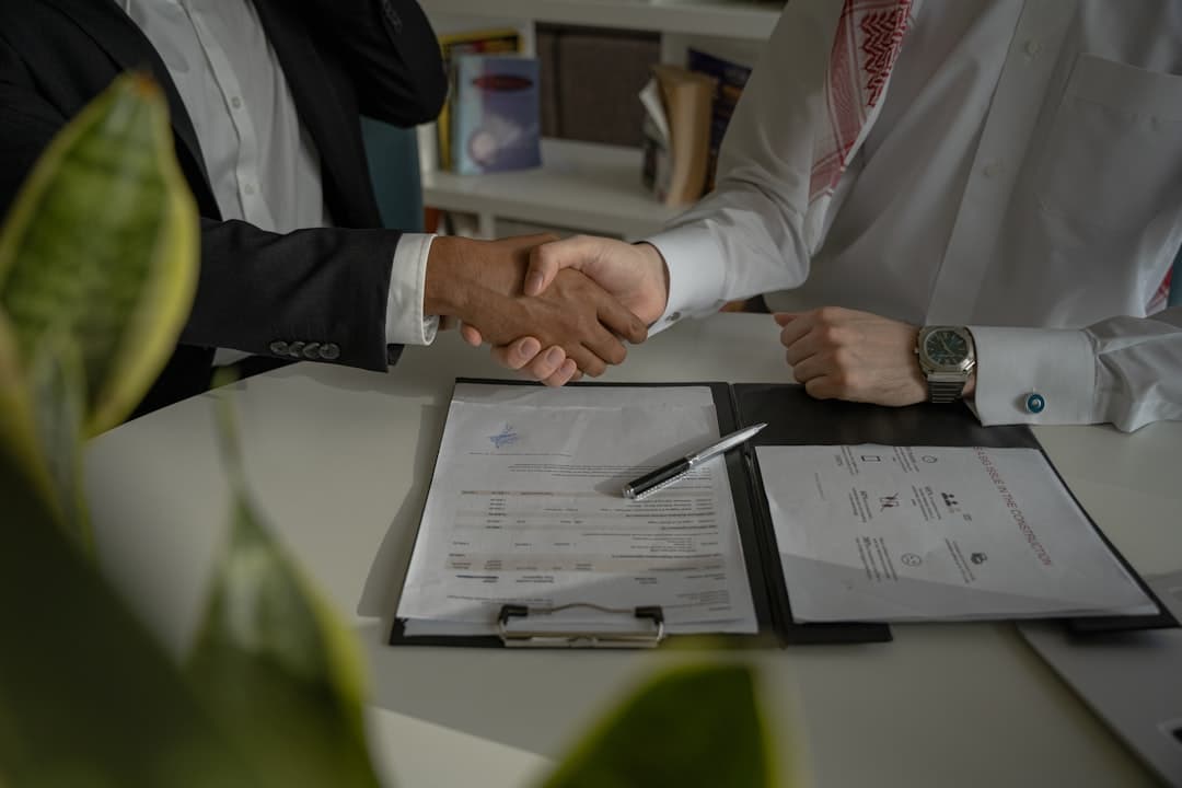 Inspector and real-estate agent meeting on a property