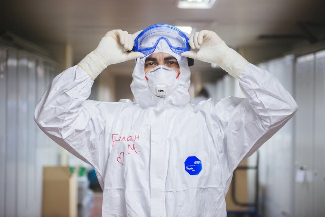 Asbestos abatement worker in protective suit