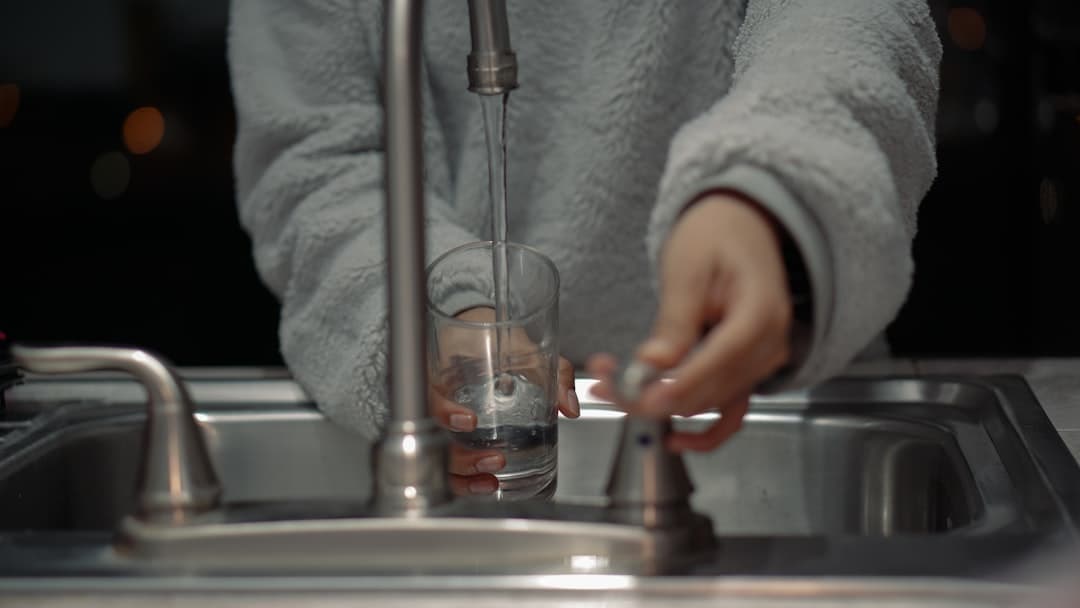 Clean drinking water flowing from a tap